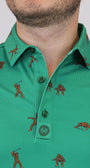 Close-up of a man wearing a green Bigfoot Patterned short-sleeve button-up shirt with a brown figure print and a chest pocket.