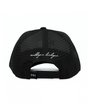 Black cap with white text on a white background