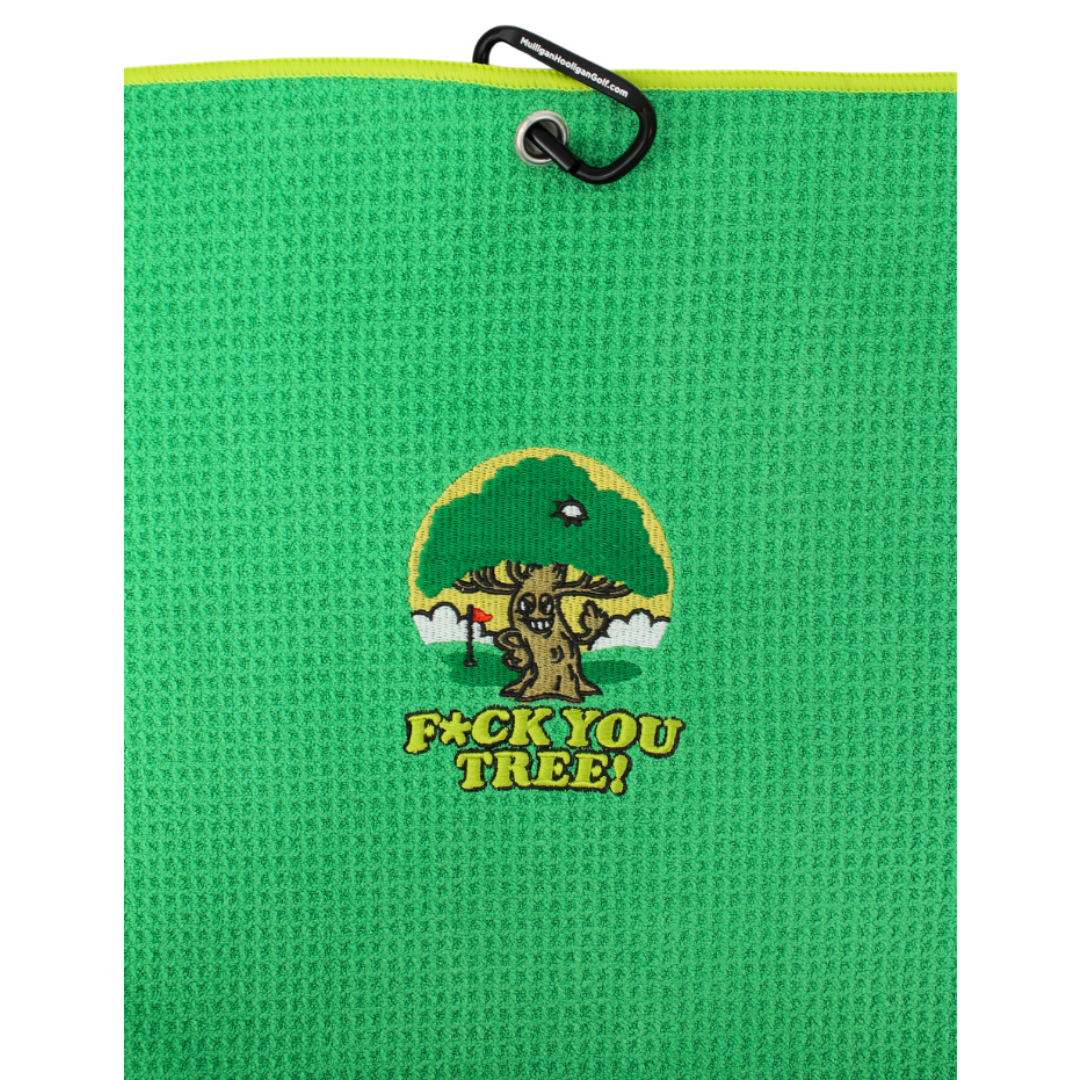 A bright green textured golf towel with a black carabiner at the top and a central embroidered logo of a tree and the text 'F*CK YOU TREE!'.