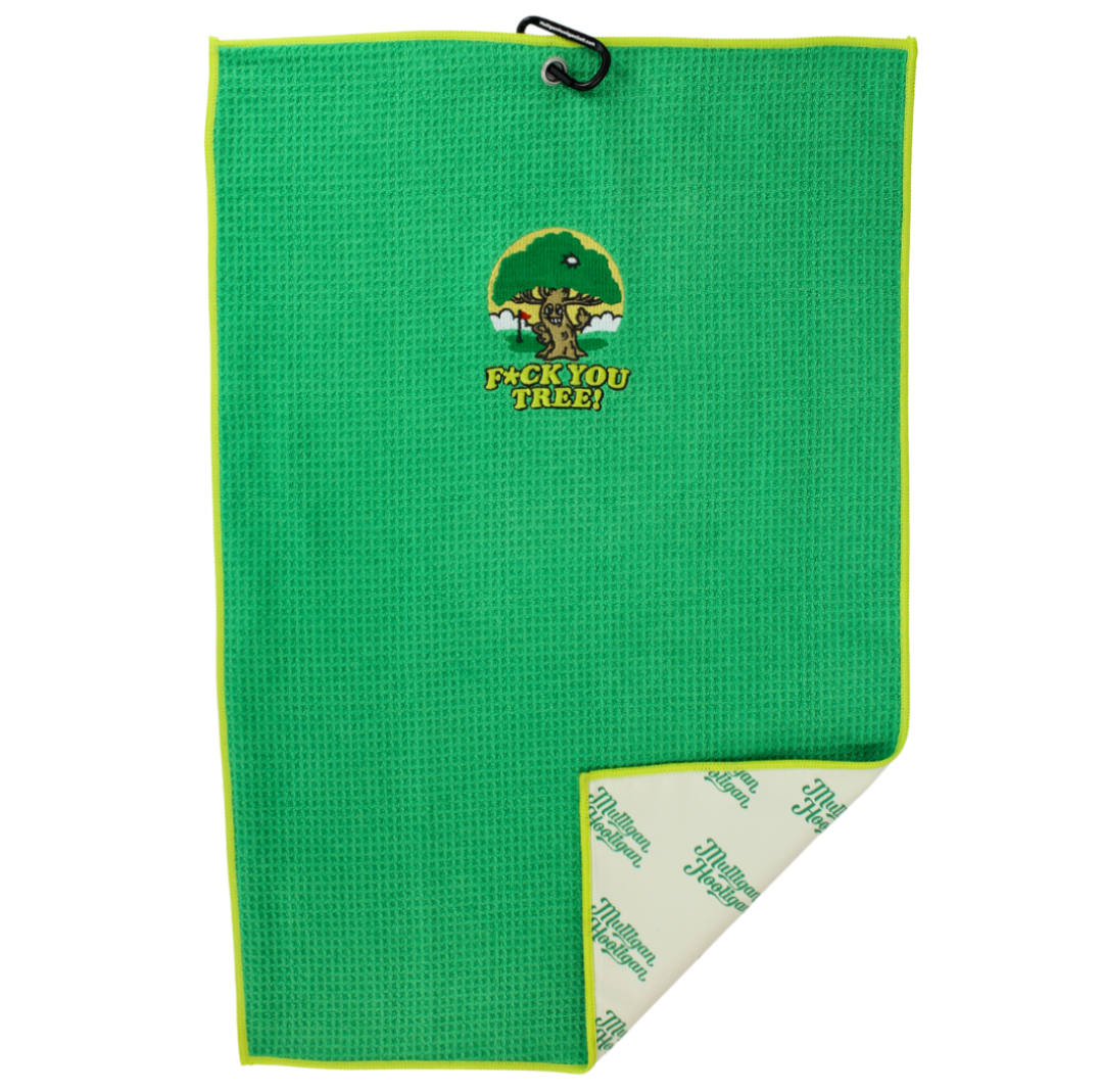 A green waffle-weave golf towel with a black hanging loop at the top and a yellow-green border. The front features a green tree logo with a golf ball and the text 'F*CK YOU TREE!' in yellow.
