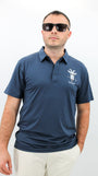 Man wearing a navy blue polo shirt with Goat logo on a white background