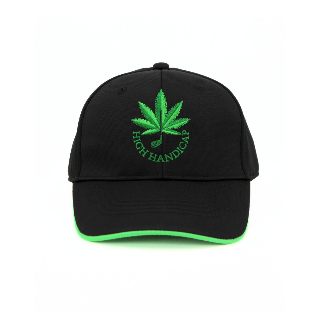 Black cap with green embroidered leaf and 'High Handicap' text on a white background