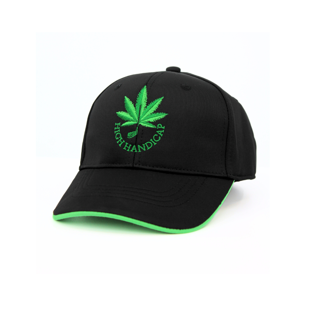 Black cap with green leaf and text design on a white background