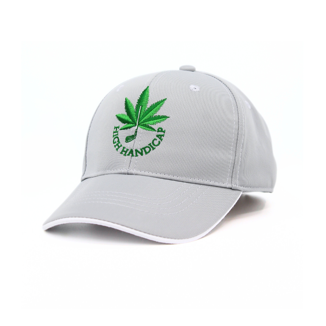 Gray cap with green cannabis leaf design and text on a white background