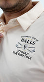 Beige polo shirt with golf-themed text and graphics on a light background