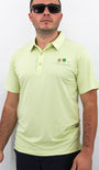 Man wearing a light green polo shirt with 'Mulligan' chest logo on a white background