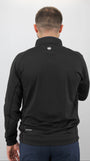 Person wearing a black jacket with a logo on the back against a white background