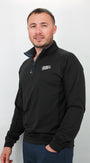 Man wearing a black quarter zip with a logo on a white background