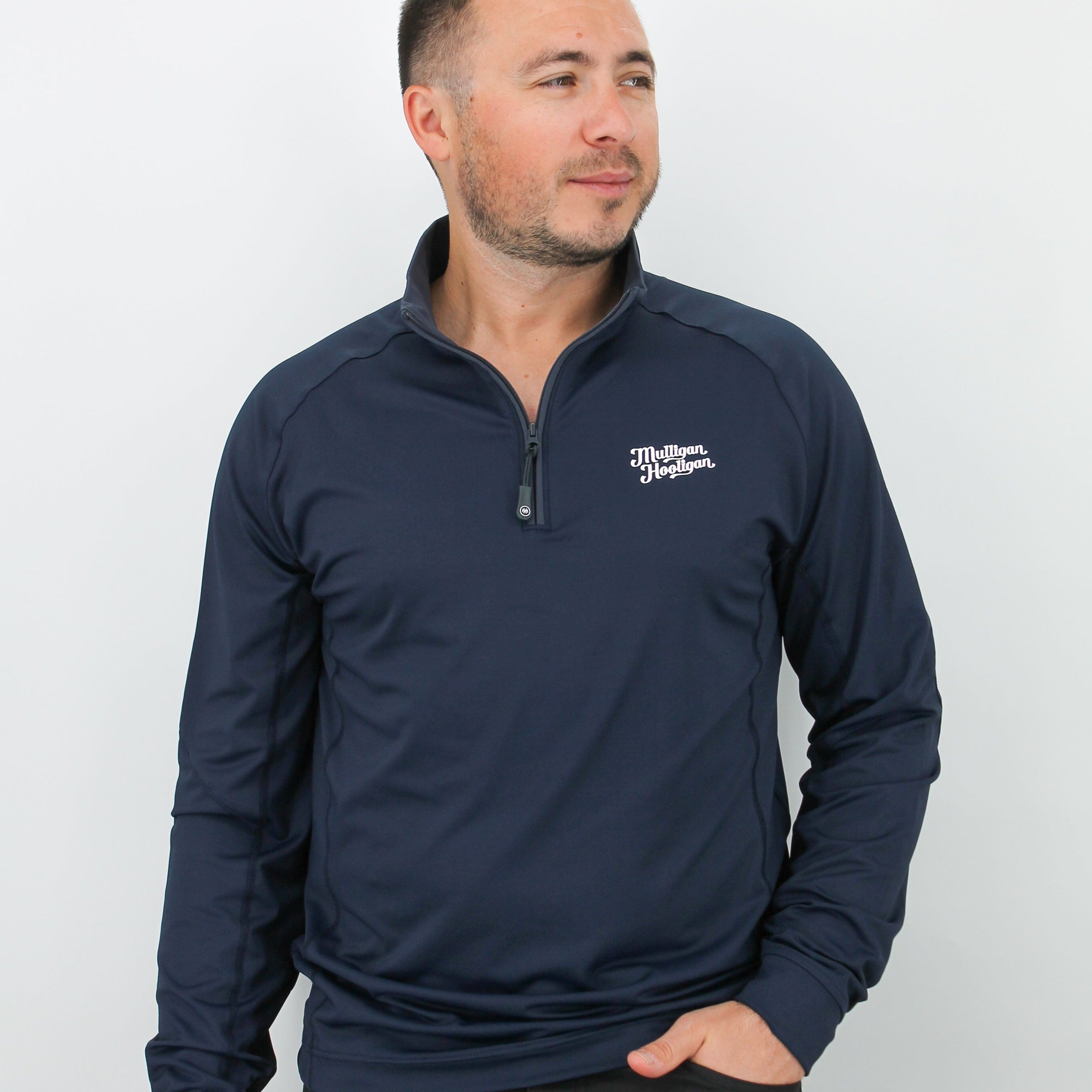 Man wearing a navy long-sleeve Quarter Zip Pullover with a 'Mulligan Hooligan' logo on a white background