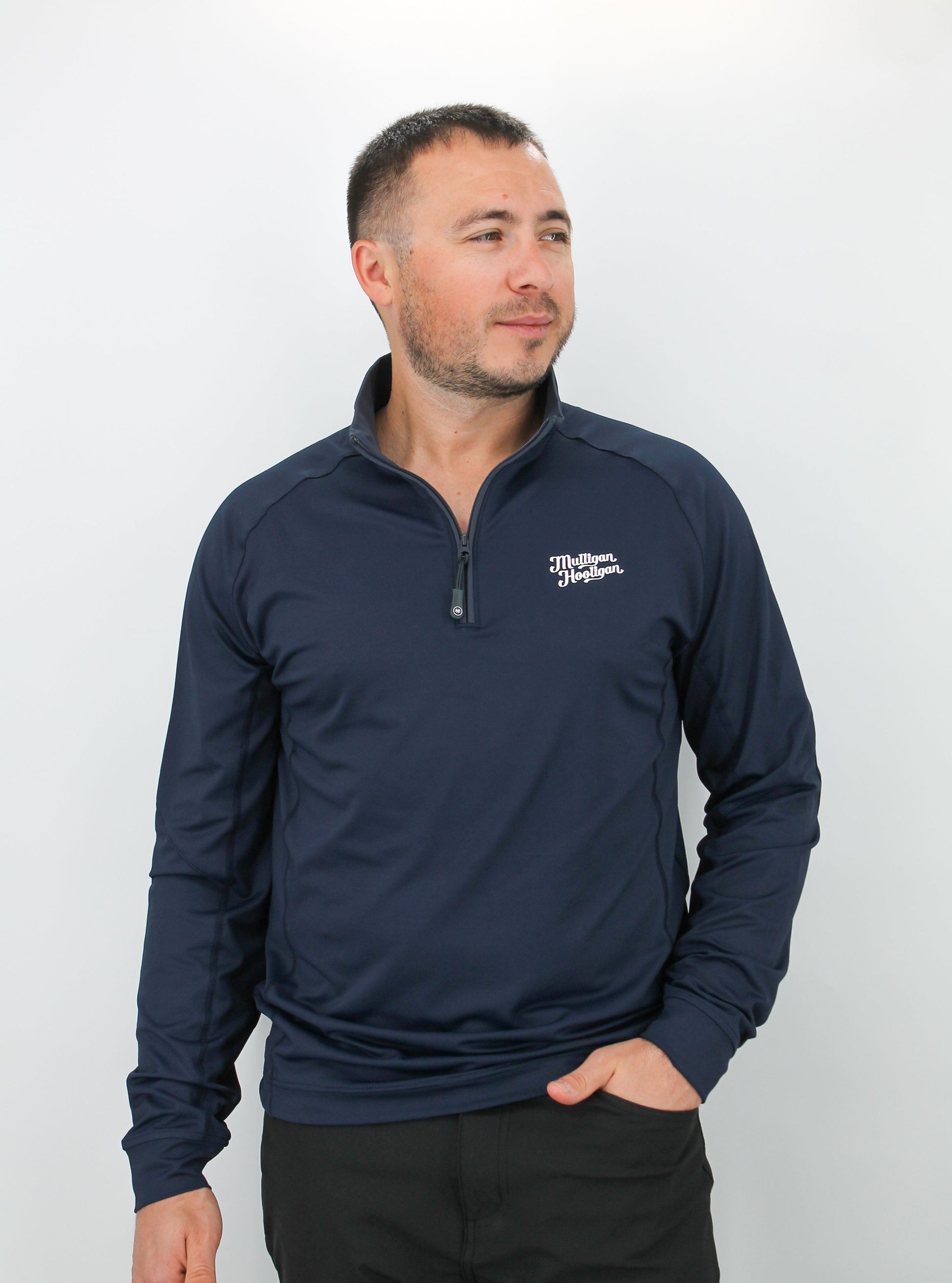 Man wearing a navy long-sleeve Quarter Zip Pullover with a 'Mulligan Hooligan' logo on a white background