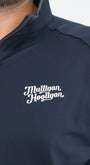 Navy blue jacket with 'Mulligan Hooligan' logo on a white background