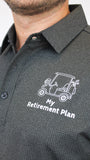 A close-up of a man wearing a dark gray micro-patterned button-down shirt with a white printed golf cart and the text 'My Retirement Plan' on the chest.