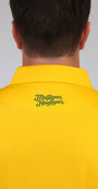 Back view of a person wearing a bright yellow collared shirt with 'Mulligan Hooligan' embroidered in green script on the upper back, against a light gray background.