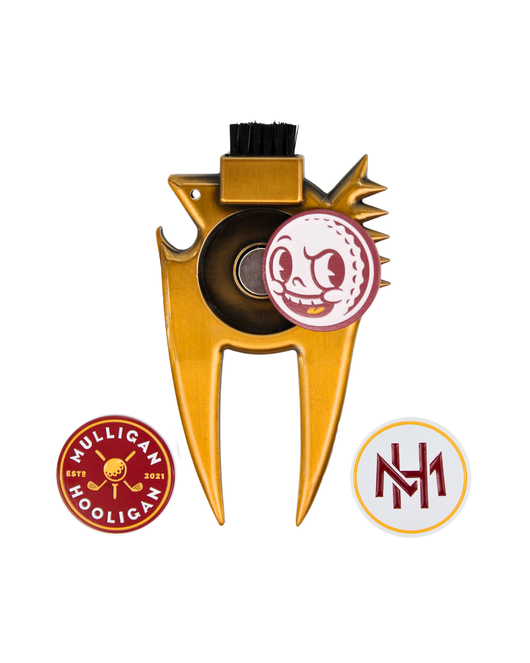 Gold metal golf club head repair tool with a black cleaning brush on top, shown on a white background with two circular branded patches: a red and white 'Mulligan Hooligan' patch and a white and red 'MH' patch.