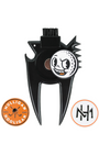 A black metal golf club divot remover and brush with a cartoon golf ball graphic, shown on a white background with two circular brand badges below.