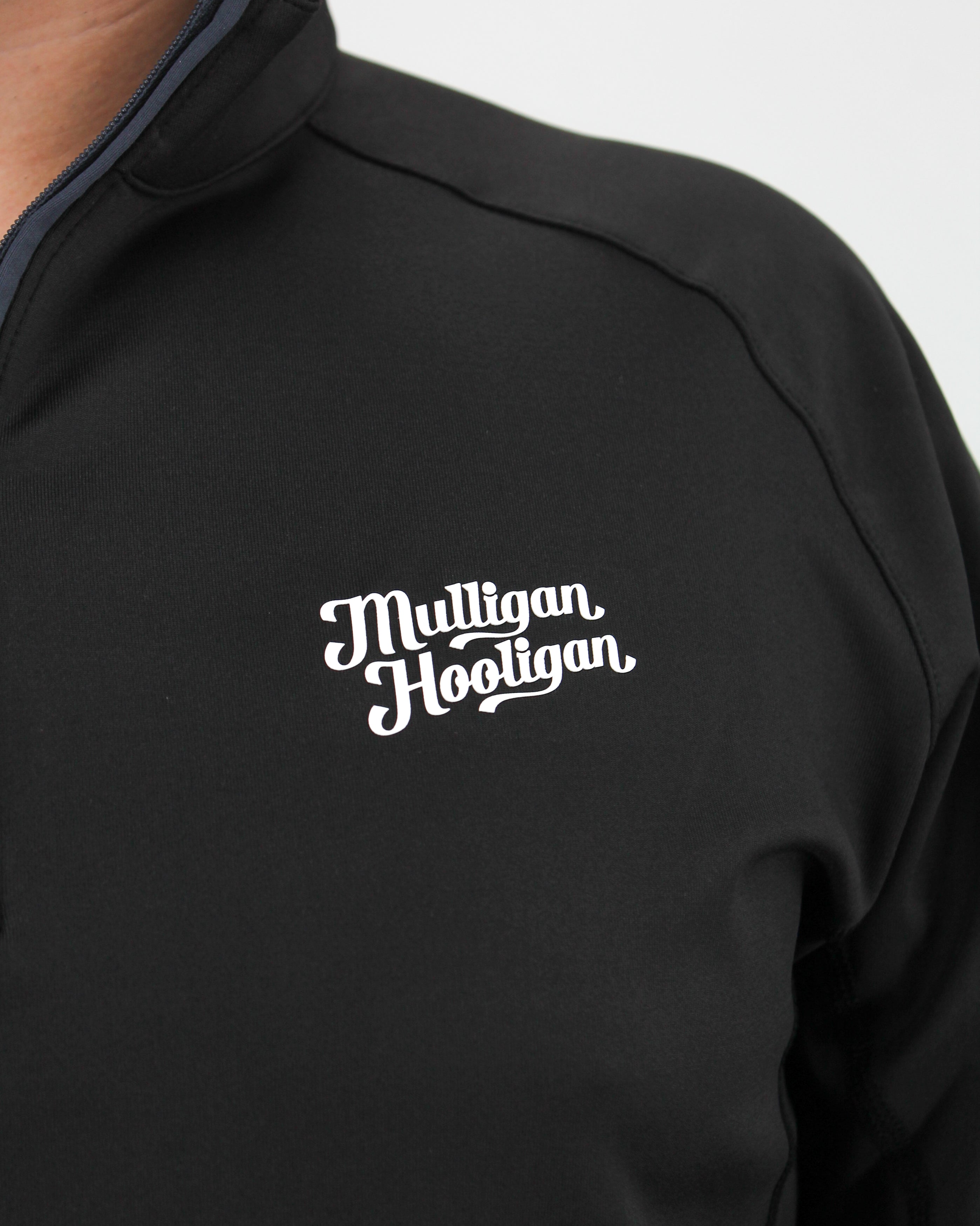 Black jacket with 'Mulligan Hooligan' logo on a white background