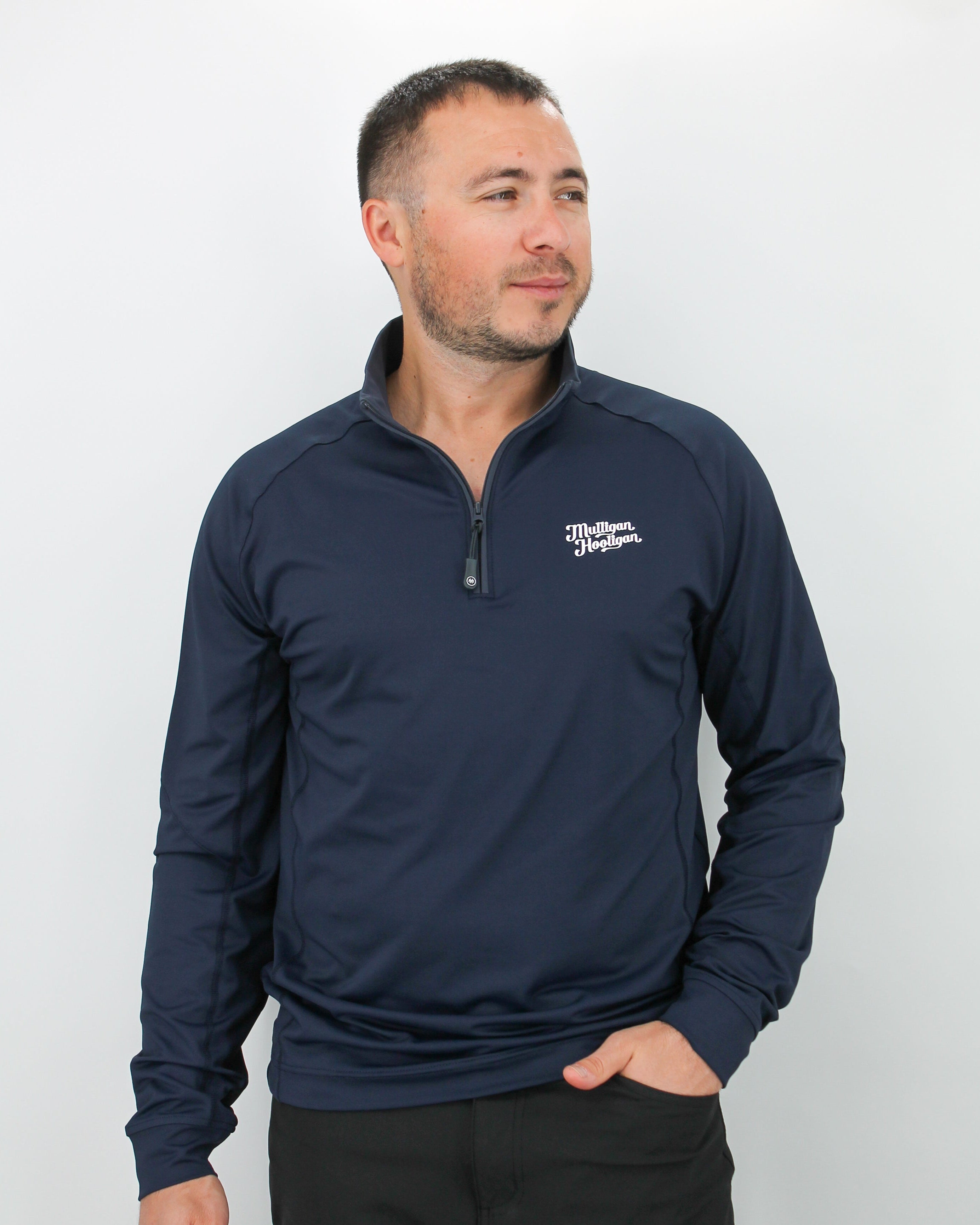 Man wearing a navy long-sleeve Quarter Zip Pullover with a 'Mulligan Hooligan' logo on a white background