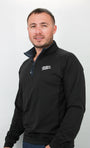 Man wearing a black quarter zip with a logo on a white background